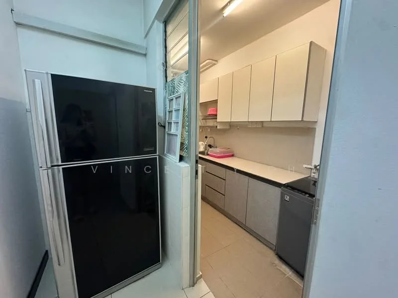 Kitchen features: black stainless-steel fridge, grey cabinetry, white countertop, single-bowl stainless-steel sink, built-in oven, ceramic tile flooring, wall-mounted cabinets, kitchen island, recessed lighting; style: modern.