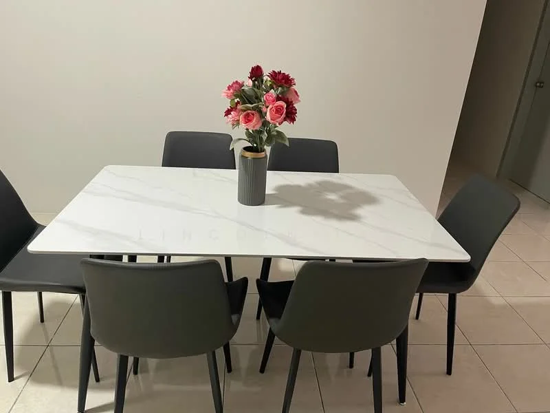 Dining features: marble dining table, 6-seater dining table, black dining chairs, decorative flower vase, ceramic flower pot, neutral wall color, tile flooring, bright lighting; style: modern.