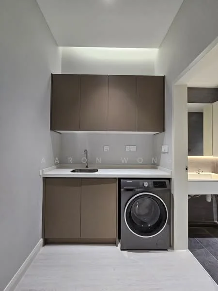 Laundry features: brown cabinetry, white countertop, single-bowl stainless-steel sink, chrome pull-down faucet, front-load washing machine, white walls, recessed LED downlights, vinyl plank flooring; style: modern.