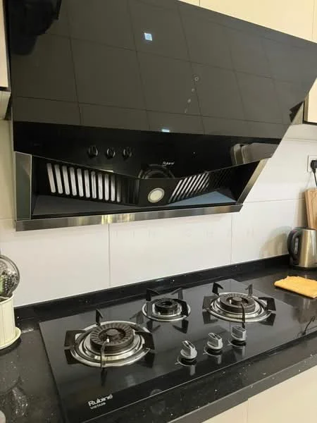 Kitchen features: black glass range hood, stainless-steel gas cooktop with 3 burners, black granite countertop, white tiled backsplash, kitchen towel, kettle; style: modern.
