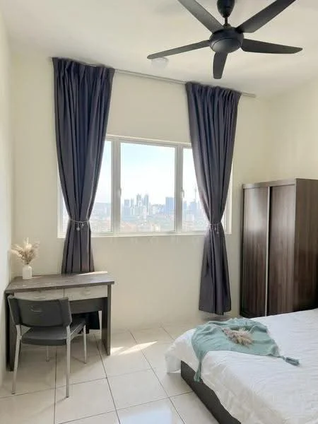 Bedroom features: queen-size bed with white bedding, dark wood wardrobe, study desk with chair, floor-to-ceiling window, grey curtains, tile flooring, ceiling fan, decorative plant on desk, city skyline view; style: modern; view: city.