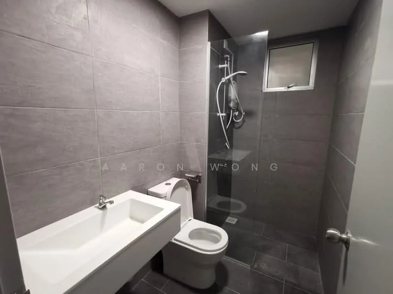 Bathroom features: grey tile cladding on walls, dark grey tile flooring, single-sink vanity with integrated basin, chrome basin mixer faucet, one-piece toilet, walk-in shower with glass enclosure, rain shower head, handheld shower, small window for natural light; style: modern.