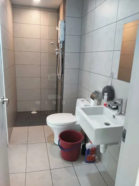 Bathroom features: grey tiled walls, light grey tiled flooring, walk-in shower with glass enclosure, chrome shower head, toilet, single-sink vanity with white cabinet, mirror above sink, soap dispenser, toilet brush holder, red bucket, cleaning supplies, shower control panel; style: modern.