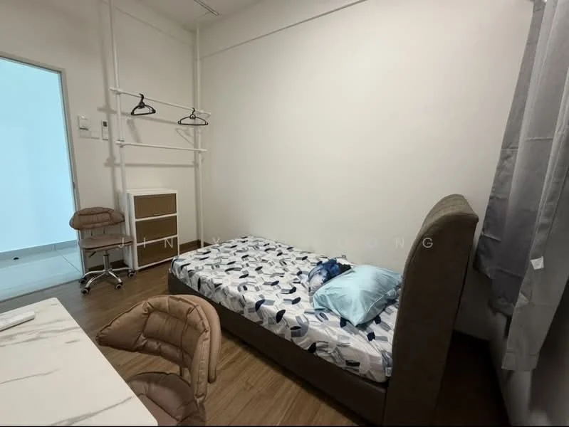 Bedroom features: single bed with mattress, bedding with blue and white pattern, upholstered headboard, study desk with marble top, rolling chair, clothes rack, wooden flooring, white painted walls, curtains, window with natural light; style: modern.