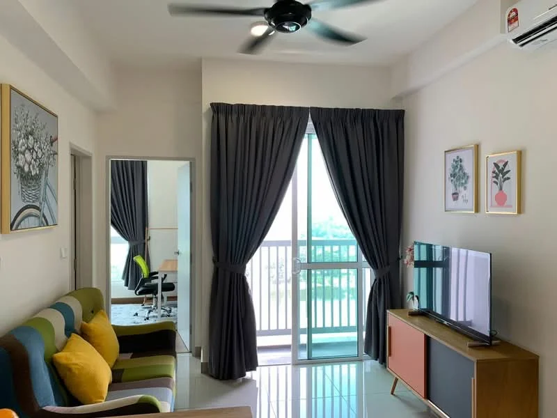 Living features: 3-seater fabric sofa in green and brown, yellow accent cushions, coffee table, wall-mounted TV, TV console with storage, floor-to-ceiling sliding glass door, curtains in dark grey, ceiling fan, glossy tile flooring, decorative wall art, framed artwork, open view from window; style: modern; view: city. Room features: door leading to another room, office chair, desk.