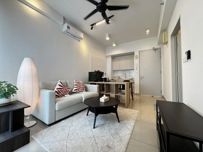 Living features: 3-seater fabric sofa in light grey, red and white patterned throw pillows, round black coffee table, area rug with geometric pattern, wall-mounted TV, black TV console, floor lamp, potted plant, wall-mounted split AC, recessed downlights, ceiling fan with light; style: modern. Kitchen features: open kitchen layout, white cabinetry, stainless-steel appliances, countertop with bar seating, built-in oven, cooktop, exhaust hood; style: modern.