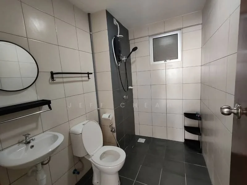 Bathroom features: white tiled walls, grey tiled flooring, round mirror, wall-mounted sink, toilet, shower with glass partition, handheld shower head, wall-mounted shower faucet, window for ventilation, towel rack, black shelving unit; style: modern.