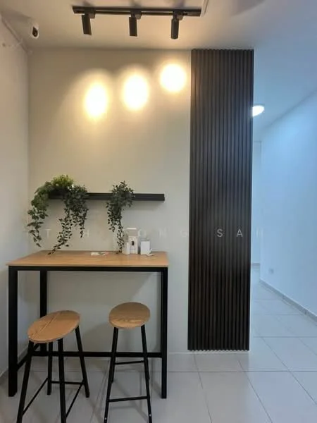 Room features: light wood bar table, two wooden stools, white painted walls, dark wood accent wall, track lighting, ceramic tile flooring, decorative plants on shelf, minimalist decor; style: modern.