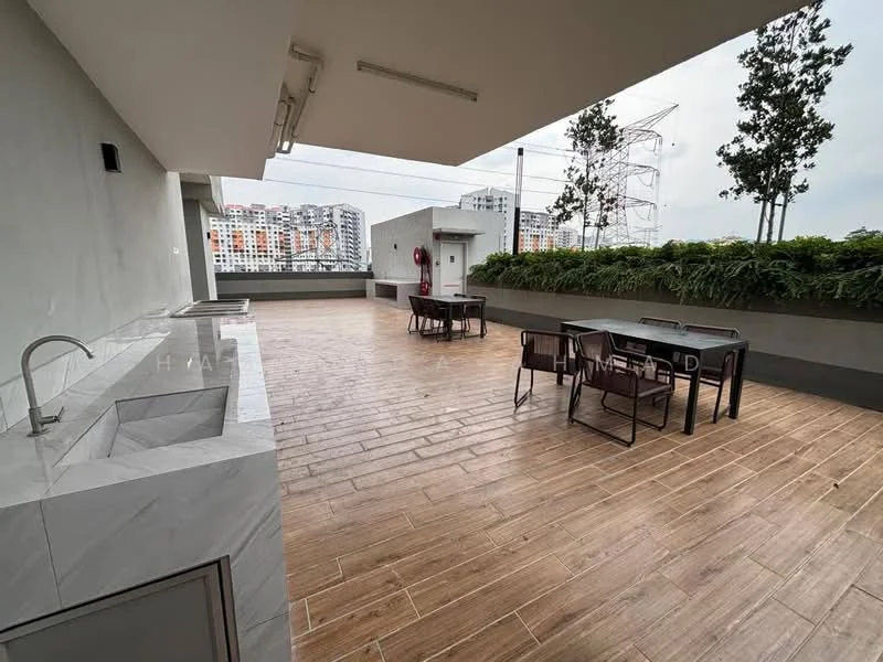 Exterior type: clubhouse; features: outdoor dining area with tables and chairs, marble countertop with sink, wooden flooring, greenery along the perimeter, city skyline view in background, safety equipment visible on wall; style: modern.