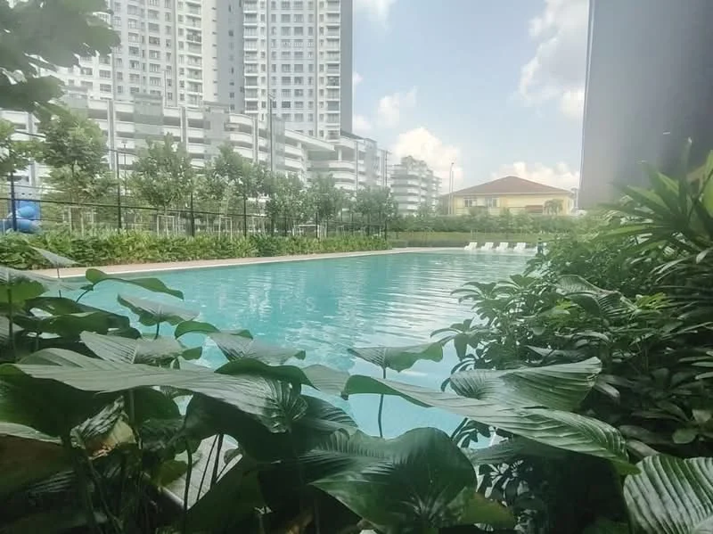 Exterior type: swimming pool deck; features: infinity pool, surrounded by tropical landscaping, manicured lawn, lounge chairs by the pool, paved walkway, high-rise buildings in background, clear blue sky; style: modern.