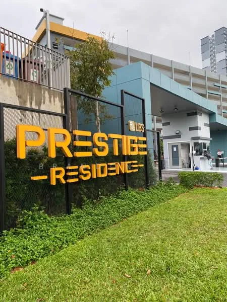Exterior features: signage with 'Prestige Residence', manicured lawn, landscaping with greenery, parking deck visible in background, modern architectural elements, entrance area with security booth; style: modern.