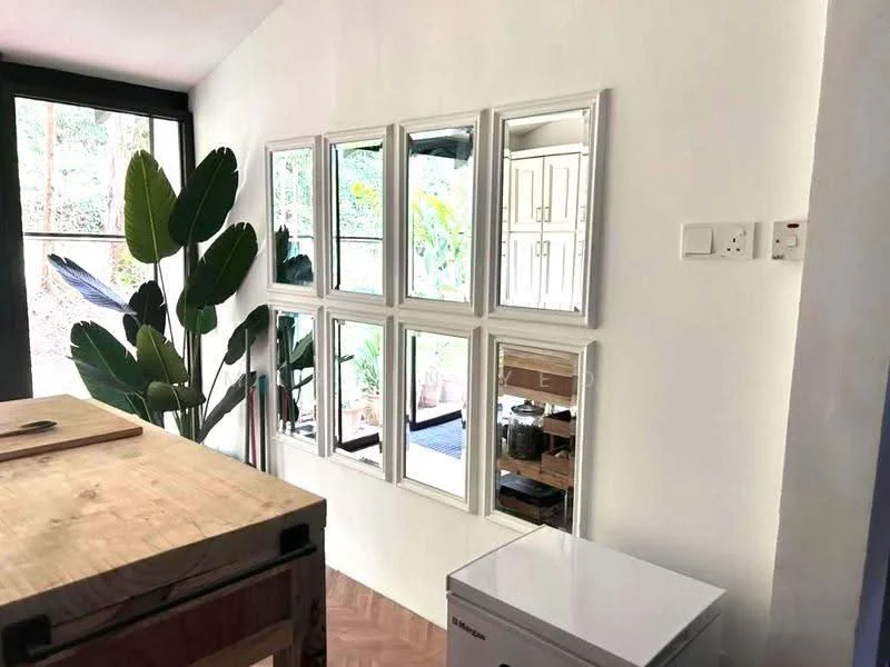 Room features: white painted walls, wooden flooring, set of framed mirrors, large indoor plant, refrigerator, kitchen island, natural light from windows; style: modern; view: garden.