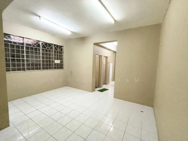 Room features: white painted walls, white tiled flooring, fluorescent ceiling lights, large window with metal grille, open layout, neutral colour scheme, no visible furniture, clean and uncluttered space; style: minimalist.