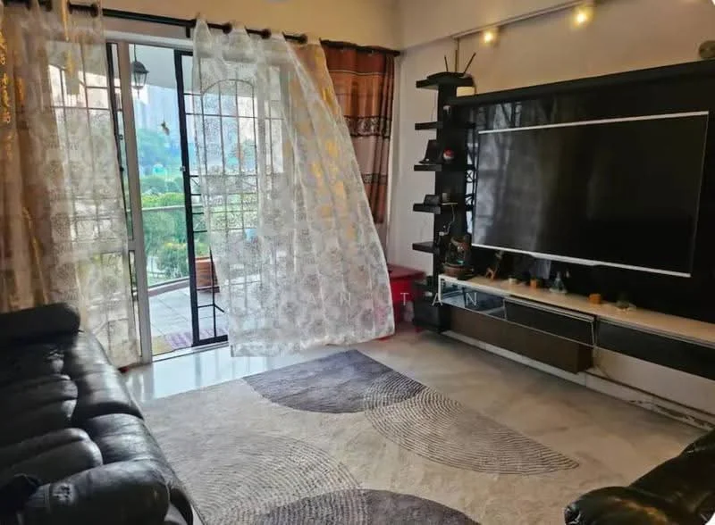 Living features: black leather sectional sofa, large area rug with circular pattern, wall-mounted flat-screen TV, dark wood TV console, floor-to-ceiling windows, sheer curtains, decorative shelves, recessed downlights, light-colored walls, sliding glass door leading to balcony, view of greenery outside; style: contemporary; view: garden.