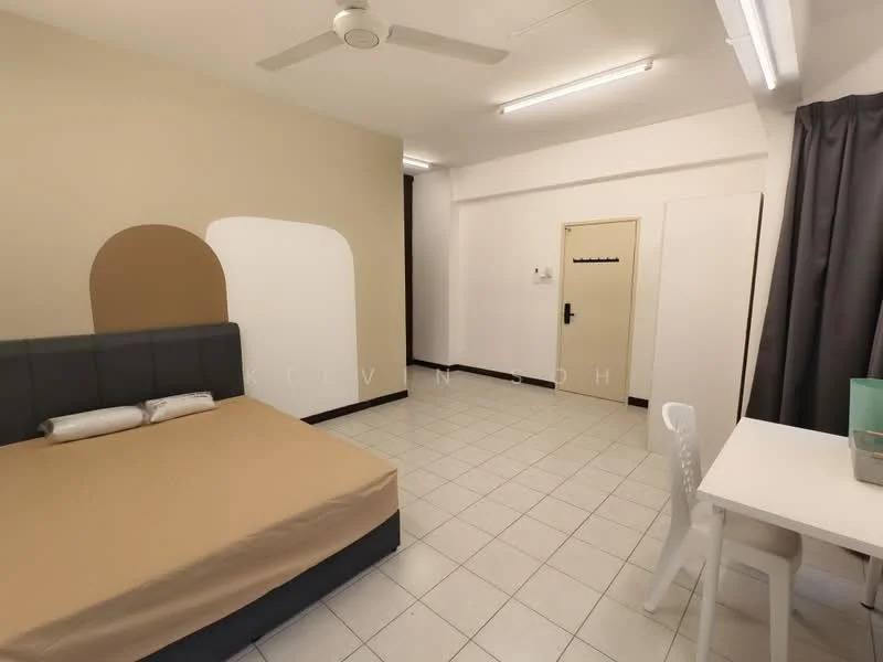 Bedroom features: queen-size bed with beige bedding, grey upholstered headboard, white walls with accent wall, ceiling fan, tile flooring, window with grey curtains, study desk with chair, built-in wardrobe, door to hallway; style: modern.