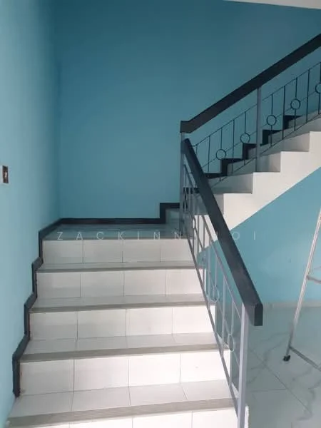 Room features: blue painted walls, white tiled flooring, metal railing with circular accents, staircase with white steps, landing area, light fixture on wall, ladder in corner; style: modern.