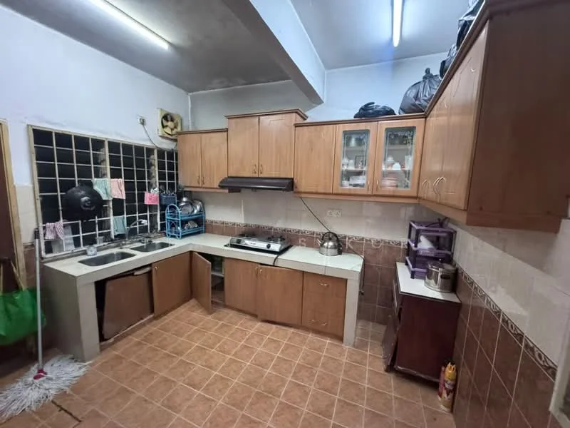 Kitchen features: brown wooden cabinetry, white countertop, double-bowl stainless-steel sink, chrome faucet, built-in gas stove, exhaust hood, tile backsplash, ceramic tile flooring, window with metal grille, open shelving, kitchen appliances visible, storage cabinet, hanging utensils, wall-mounted light fixtures; style: traditional.