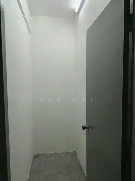 Room features: white painted walls, concrete flooring, single door, overhead lighting.