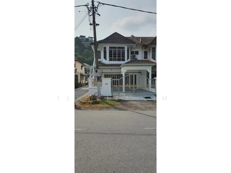 Exterior type: semi-detached house; features: white painted facade, double-storey, pitched tile roof, front porch with railing, garden area in front, driveway with interlocking pavers, visible air conditioning units, street view, surrounded by residential area; style: modern.
