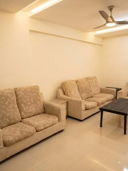 Living features: beige fabric 3-seater sofa, beige fabric 2-seater sofa, black coffee table, cream painted walls, recessed LED downlights, ceiling fan, glossy tile flooring; style: modern.