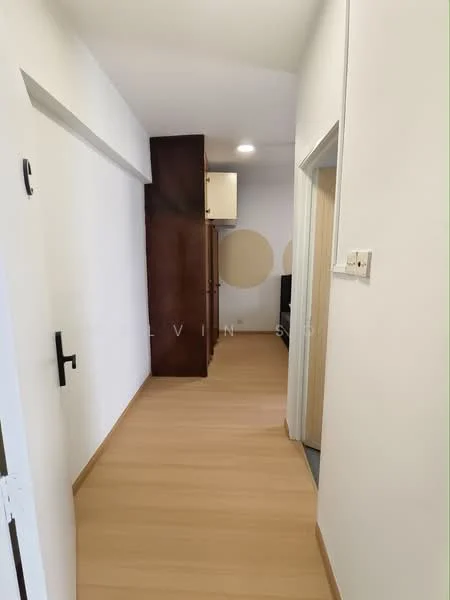 Room features: light wood laminate flooring, white painted walls, built-in wardrobe with dark wood finish, recessed ceiling lights, door leading to another room, door leading to bathroom, neutral color scheme; style: modern.