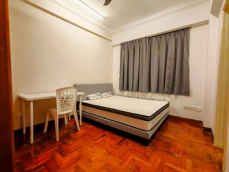 Bedroom features: queen-size bed, upholstered headboard, wooden flooring, white painted walls, grey curtains, study desk, plastic chair, ceiling fan; style: modern.