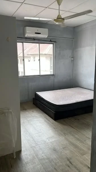 Bedroom features: wooden flooring, grey painted walls, window with view, air conditioning unit, ceiling fan, unmade bed with mattress, curtain rod, light fixture, baseboard.