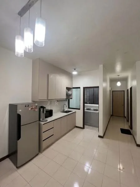 Kitchen features: light grey cabinetry, white countertop, stainless-steel sink, chrome pull-down faucet, built-in oven, freestanding range oven, stainless-steel fridge, microwave, pendant lighting, tile flooring, white painted walls, recessed lighting; style: modern. Hallway features: tile flooring, white painted walls, doorway to laundry area, doorway to bedroom, doorway to bathroom, ceiling light fixture; style: modern.
