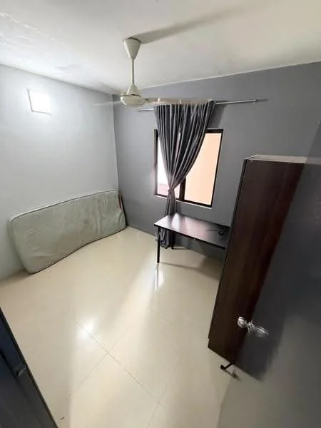 Bedroom features: grey painted walls, tile flooring, ceiling fan, window with curtain, desk, mattress on the floor, wardrobe.