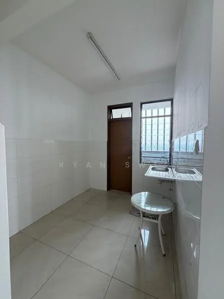 Room features: white painted walls, tile flooring, single window with metal grille, door with wooden frame, sink with countertop, overhead fluorescent lighting, round table, empty space; style: minimalist.
