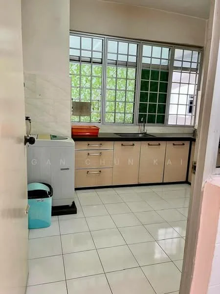 Kitchen features: white tiled flooring, cream cabinetry, black countertop, single-bowl stainless-steel sink, chrome faucet, window with grid pattern, green backsplash, built-in kitchen cabinet, washing machine, trash bin; style: modern; view: garden.