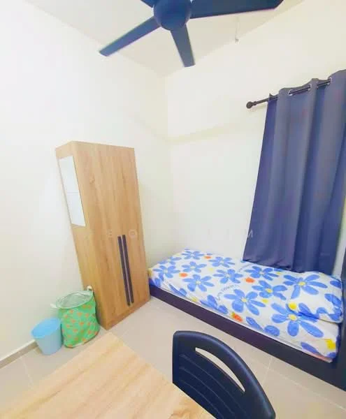 Bedroom features: single bed with floral bedding, wooden wardrobe with two doors, ceiling fan, dark curtains, tile flooring, small waste bin, wooden table, black chair.