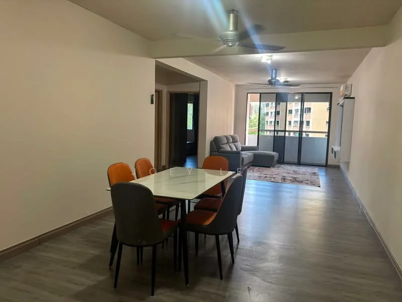 Living features: grey fabric sofa, 4-seater dining table with white top, orange dining chairs, grey dining chairs, area rug with geometric pattern, 2 ceiling fans, floor-to-ceiling windows, light-colored walls, laminate flooring; style: modern; view: garden.