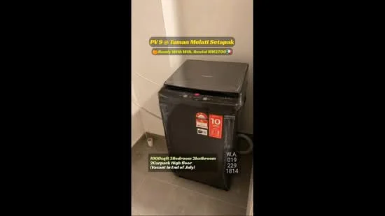 Room features: black fridge, energy-efficient rating, top freezer, stainless-steel handle, visible power cord, tile flooring, neutral wall color, corner placement; style: modern.
