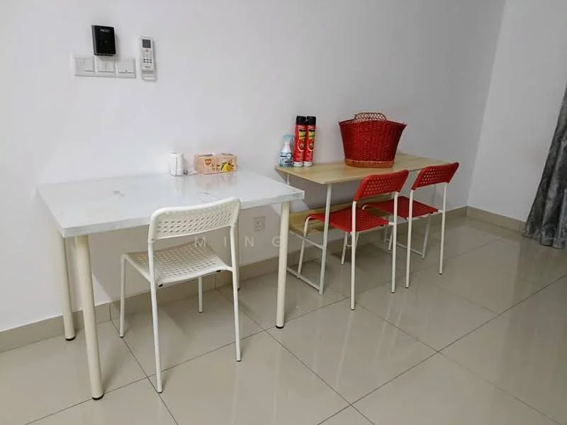 Room features: white walls, glossy beige floor tiles, two tables, white table with four legs, wooden table, three red plastic chairs, basket on table, various bottles on table, wall-mounted intercom, curtains on window; style: modern.
