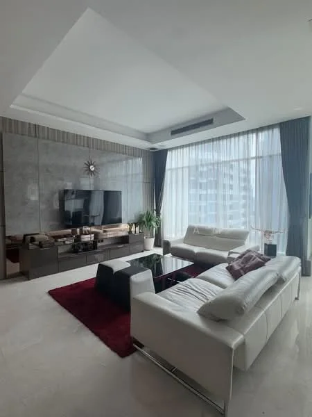 Living features: white leather sofa, 2-seater white leather sofa, black coffee table, red area rug, wall-mounted TV, dark wood TV console, floor-to-ceiling windows, sheer curtains, grey accent wall, potted plant, recessed ceiling with lighting, decorative wall clock; style: modern; view: city.