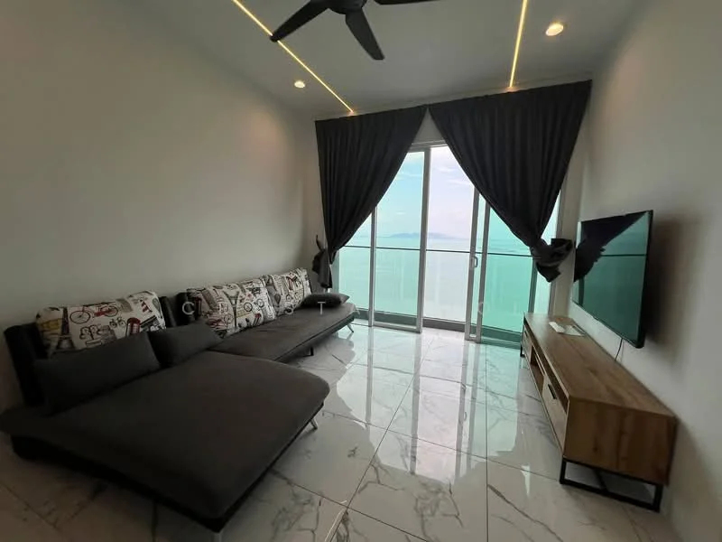 Living features: grey fabric sectional sofa, black throw pillows, marble tile flooring, floor-to-ceiling windows, sliding glass door, grey curtains, wall-mounted TV, wooden TV console, recessed LED downlights, ceiling fan with light, decorative wall with artwork; style: modern; view: sea.