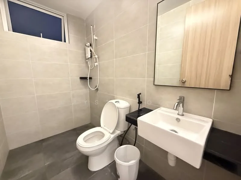 Bathroom features: white tiled walls, grey tiled flooring, single-sink vanity with wall-mounted faucet, framed mirror, one-piece toilet, shower with handheld showerhead, black countertop, white waste bin; style: modern.