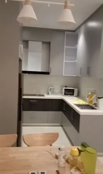 Kitchen features: grey cabinetry, white upper cabinets, stainless-steel sink, chrome pull-down faucet, built-in microwave, freestanding range oven, white countertop, tile backsplash, refrigerator, pendant lighting, wooden dining table, wooden chairs; style: modern.
