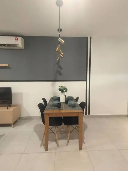 Dining features: wooden dining table, 4 black upholstered dining chairs, pendant lamp with gold accents, air conditioning unit on wall, grey accent wall, white painted walls, ceramic tile flooring, decorative plant in vase; style: modern.