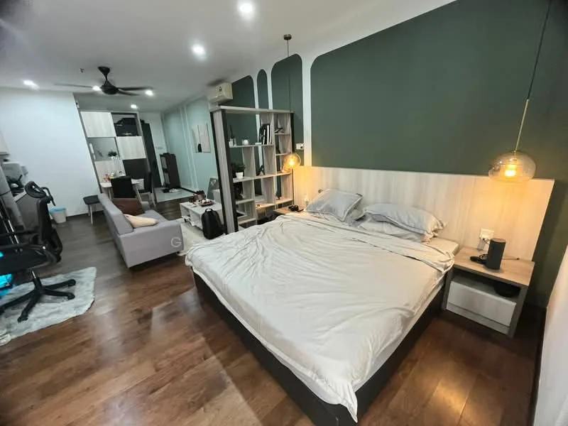 Bedroom features: king-size bed with grey bedding, wooden headboard, two pendant lights, green accent wall, light wood paneling behind bed, laminate flooring, built-in wardrobe, open shelving unit, desk with chair, sofa, area rug, wall-mounted air conditioning unit, floor lamp; style: modern.