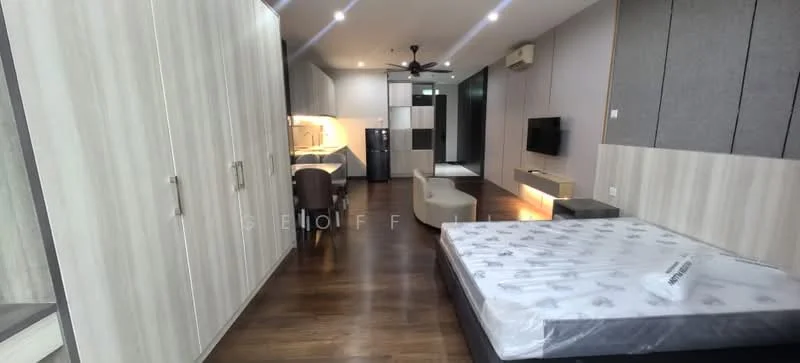 Room features: laminate wood flooring, grey accent wall, white painted walls, ceiling fan, recessed downlights, built-in wardrobe with sliding doors, wall-mounted TV, sofa, dining table with chairs, kitchenette with countertop, stainless-steel fridge, kitchen cabinets, open layout; style: modern.