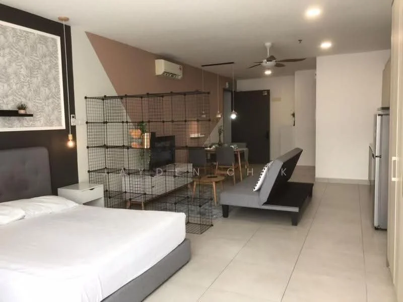 Room features: grey upholstered bed frame, white mattress, black metal room divider, wall-mounted TV, wooden dining table, grey fabric sofa, recessed downlights, air conditioning unit, sliding glass door, light-colored tile flooring, decorative wall with floral pattern, dark accent wall, open shelving unit, floor lamp, kitchenette with fridge; style: modern.