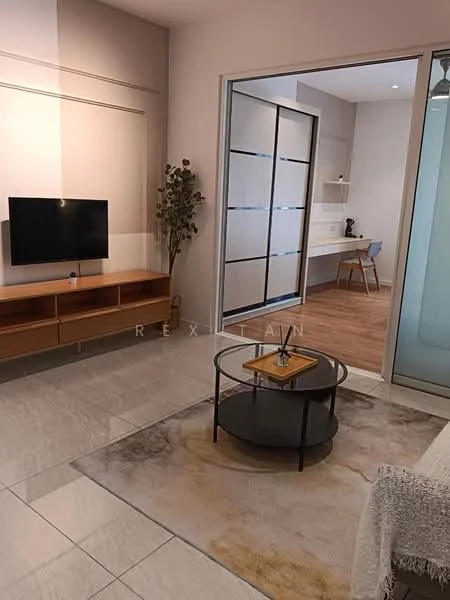 Living features: wall-mounted TV, wooden TV console, round coffee table with black base, area rug with abstract pattern, large windows with natural light, decorative plant in pot, light-colored walls, tile flooring, open layout to adjacent room; style: modern. Room features: wooden flooring, kitchenette with countertop, chair, shelves.