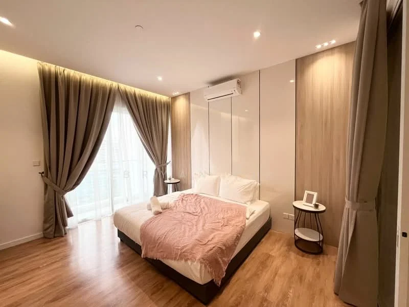 Bedroom features: queen-size bed with white bedding, upholstered headboard, wooden bedside table, table lamp, floor-to-ceiling windows, sheer curtains, dark brown wooden flooring, wall-mounted air conditioning unit, wood panel accent wall, recessed downlights, decorative throw blanket; style: modern; view: city.