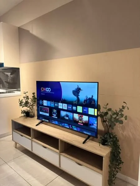 Living features: large flat-screen TV, wooden TV console, decorative plants, light-colored wall, grey accent wall, ceramic tile flooring, open shelving, storage cabinets; style: modern.