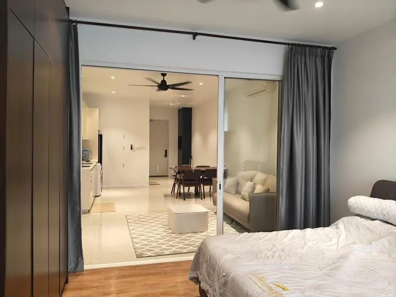 Bedroom features: queen-size bed, upholstered headboard, wooden flooring, ceiling fan, floor-to-ceiling sliding glass door, grey curtains, built-in wardrobe; style: modern; view: living. Living features: sofa in light color, dining table with chairs, recessed downlights, open layout, tile flooring; style: modern.