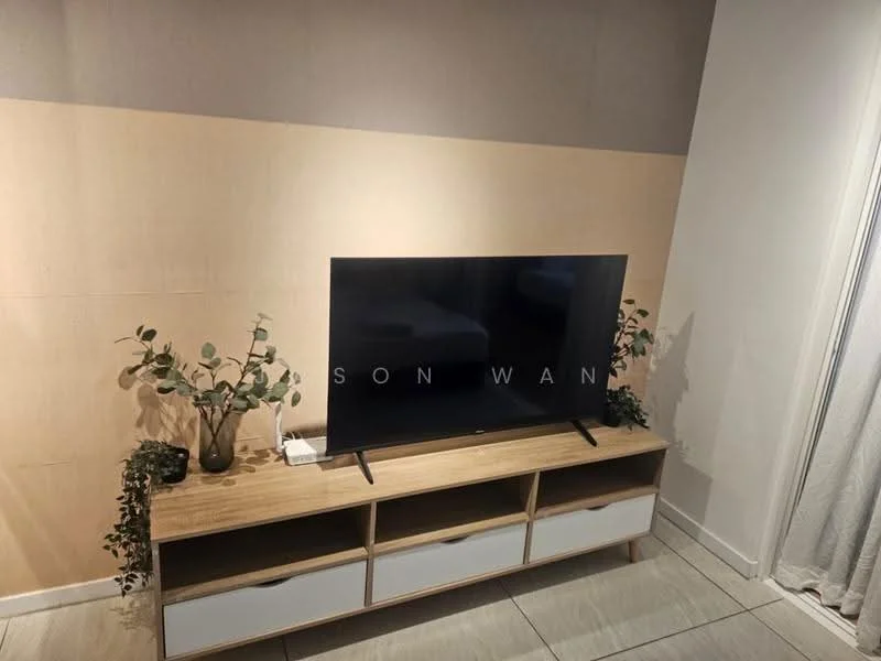Living features: flat-screen TV on stand, wooden TV console with drawers, light wood finish on console, decorative plants on console, light grey wall with wood paneling, white tiled flooring, curtains, neutral color scheme; style: modern.