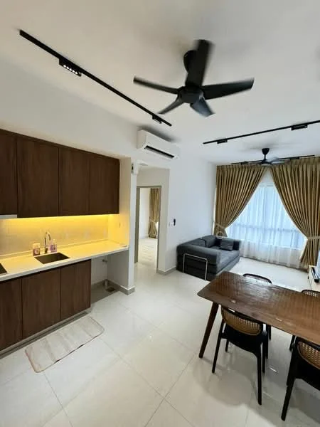 Kitchen features: brown wooden cabinetry, white countertop, single-bowl stainless-steel sink, chrome pull-down faucet, recessed LED downlights; style: modern. Living features: 3-seater grey fabric sofa, wooden dining table, 4 black dining chairs, ceiling fan with light, curtains in beige, white walls, tile flooring, air conditioning unit; style: modern.