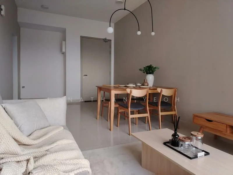 Living features: light grey walls, white ceiling, marble tile flooring, 3-seater fabric sofa in light beige, wooden dining table for 4, wooden dining chairs, decorative vase with greenery, coffee table in wood, decorative tray on coffee table, reed diffuser, wall-mounted light fixture, minimalist decor; style: minimalist.
